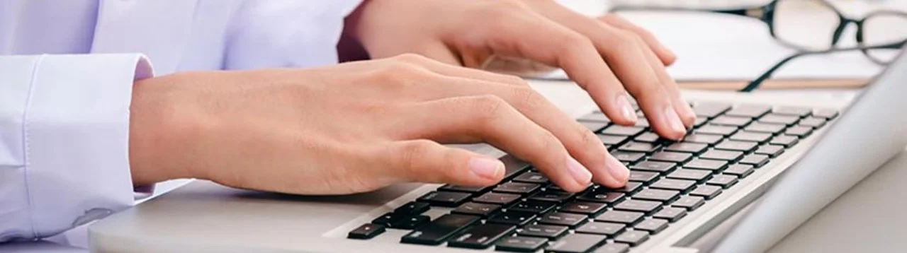 close-up of hands on a keyboard